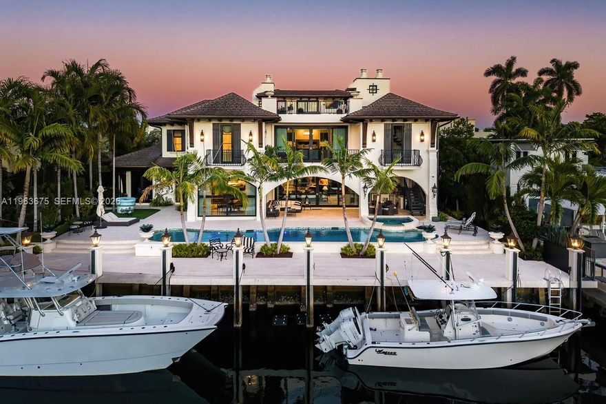 A masterfully crafted Mediterranean estate of scale, presence, and charm, this custom three-story residence commands 100 feet of prime waterfront in the heart of Las Olas Isles. Designed for grand living and entertaining alike, the home is enriched by meticulous detail, generous living areas, and timeless architectural design throughout. A dramatic two-story foyer opens to expansive formal living and dining rooms with a custom wine cellar and built-in saltwater aquarium, while the gourmet chef’s kitchen centers around a one-of-a-kind statement island.

The main level reveals a breakfast room, butler’s pantry, executive office with cylindrical aquarium and custom millwork, wet bar, VIP guest suite, cabana bath, and integrated service spaces. The waterfront primary suite offers serene water views, his-and-hers spa-caliber baths, boutique-style dressing rooms, and a private balcony. Three additional ensuite guest suites, secondary laundry, media lounge, rooftop terrace with full bath and summer kitchen, saltwater pool and spa, two summer kitchens, climate-controlled garages with golf cart bay, and generator complete this exceptional Fort Lauderdale estate.