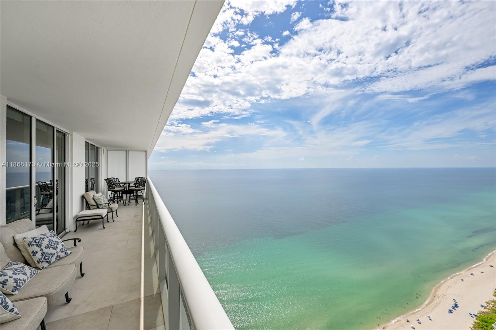 Stunning furnished 2-bedroom plus enclosed den, 3-bath residence showcases sweeping ocean and Intracoastal views. The primary suite offers a luxurious Jacuzzi tub, while the European-style kitchen features granite countertops and premium appliances. Elegant ceramic flooring runs throughout, enhancing the home’s modern sophistication. Thoughtfully designed sleeping arrangements include a king bed in the primary suite, twin beds in the second bedroom, and a sofa bed in the den—ideal for family and guests alike. Enjoy 5-star, resort-style living with a full-time concierge and security, 24-hour valet, five heated pools, and a 50,000 sq. ft. spa and fitness center overlooking the Atlantic. Ideally located near Gulfstream Park, Hollywood Boardwalk, Bal Harbour, South Beach, and Las Olas.