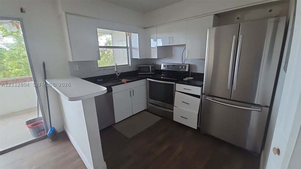 Photo of 1100 SE 4th Ave #30, Deerfield Beach, FL 33441 (MLS # A12112804)
