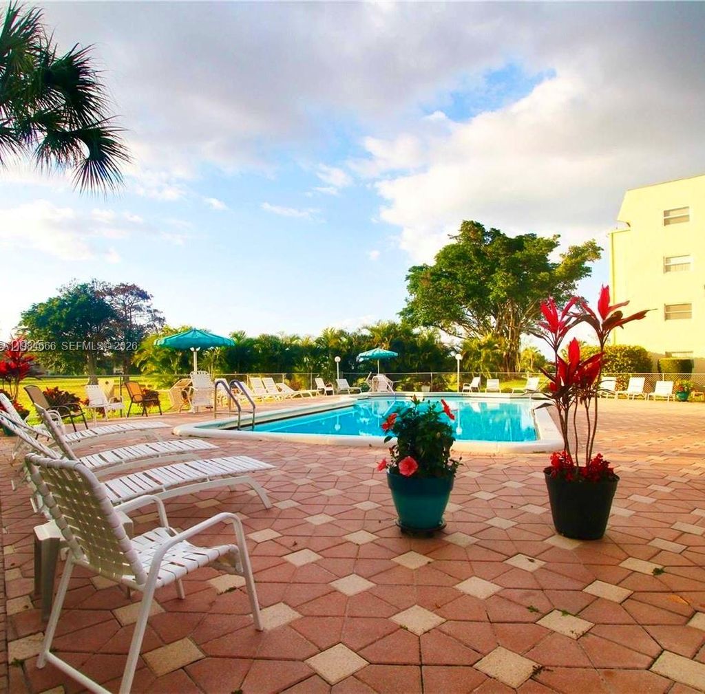 Photo of 1035 Country Club Dr #104, Margate, FL 33063 (MLS # A11984666)