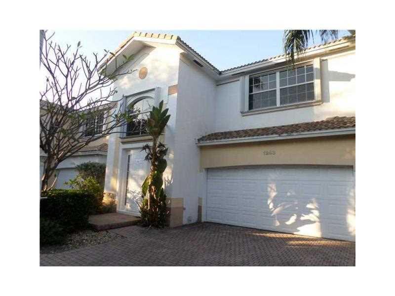 Bright and spacious 2-Story house located in East Hollywood. 2 Bedroom, 2 1/2 bath and loft can be used as a 3rd room home with great loft area on 2nd floor, vaulted ceilings, formal dining room, large eat-in kitchen, 2 car garage and in ground pool. Cor ner lot located inside this desirable gated community which offers pool & spa. Located near Hollywood Beach Golf &