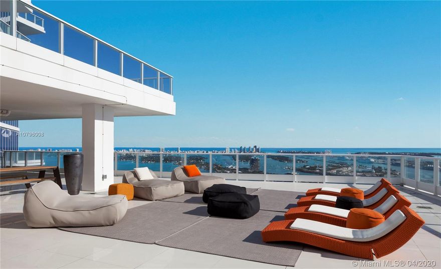 ONE-OF-A-KIND MIAMI PENTHOUSE WITH MASSIVE PRIVATE ROOFTOP DECK & 360 DEGREE WRAPAROUND VIEWS! 3,000 SF Entertaining Deck offers Covered Eating Areas & Open Air Sun-bathing Space. Direct Bay & Ocean Views to the East + Unobstructed Sunset & City of Miami Views to the West. This Sky Home has European flair everywhere with Light Bleached Oak Hardwood Floors throughout the 4,437 SF of interior Living Space & Italian Design with 10FT Ceilings. Open floorplan that flows comfortably to Separate Master Bedroom wing w Private Balcony. Master Bath has stand-alone Tub & separate Shower. 2 Guest Bedrooms w en-suite Baths & Separate 4th Bedroom for service or guest house. Open custom Kitchen & Bar. 2 Parking + Large Storage Space.