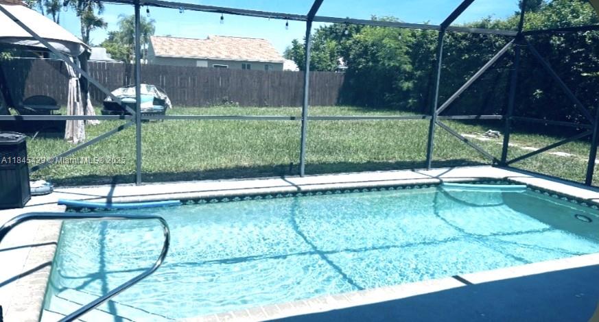 Beautiful 1story single-family pool home,3 bdrms, 2 baths, w/dedicated office space in nice neighborhood of Boca Trace, top-rated schools,low HOA. Comfort, style, & convenience. Bright/open layout w/white porcelain tile & laminate floors throughout! Modern kitchen w/S-steel appl, granite counters,backsplash, cozy breakfast area. Sliding doors provide natural light throughout living areas.Large master ste, walk-in closet,pool view,updated en-suite bath,walk-in shower.Indoor-outdoor living w/screened-in salt water, heated pool overlooking the expansive fully fenced bckyrd. A/C (approx 5y/o),water heater (approx 1y/o), W&D, 1 car gge. Indoor patio that can be set up as a garden or for storage.Great location near the Turnpike,shopping,dining, & top-rated schools. Sold AS IS w/right to inspect.