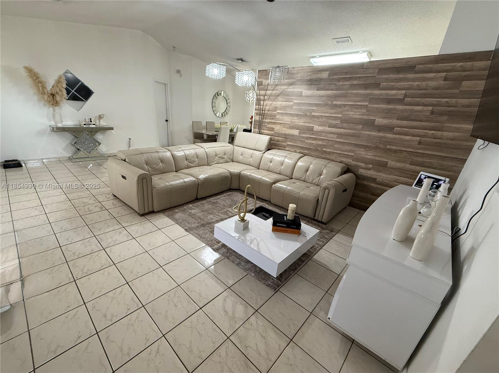 Step inside this spacious 4-bedroom, 3-bath home with soaring ceilings. Perfect for families, it features an inviting open-concept layout that’s ideal for everyday living and entertaining. The garage has been thoughtfully converted and includes its own bathroom, making it a perfect in-law suite or private guest space