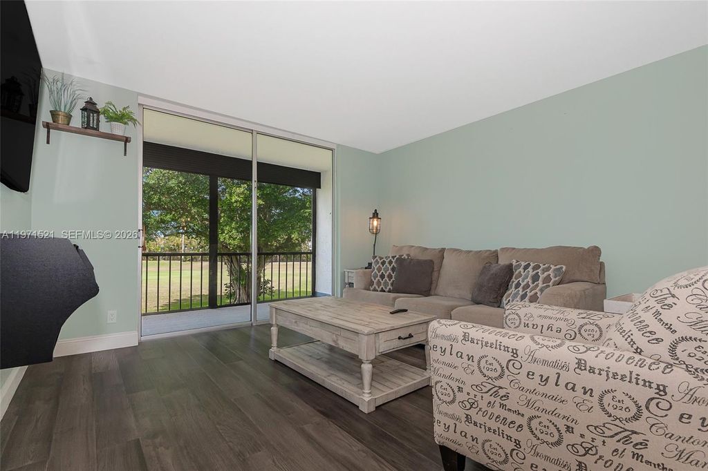 Photo of 9811 N Hollybrook Lake Dr #204, Pembroke Pines, FL 33025 (MLS # A11971521)