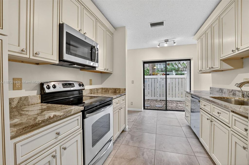 Photo of 4843 NW 22nd St #4157, Coconut Creek, FL 33063 (MLS # A11873786)