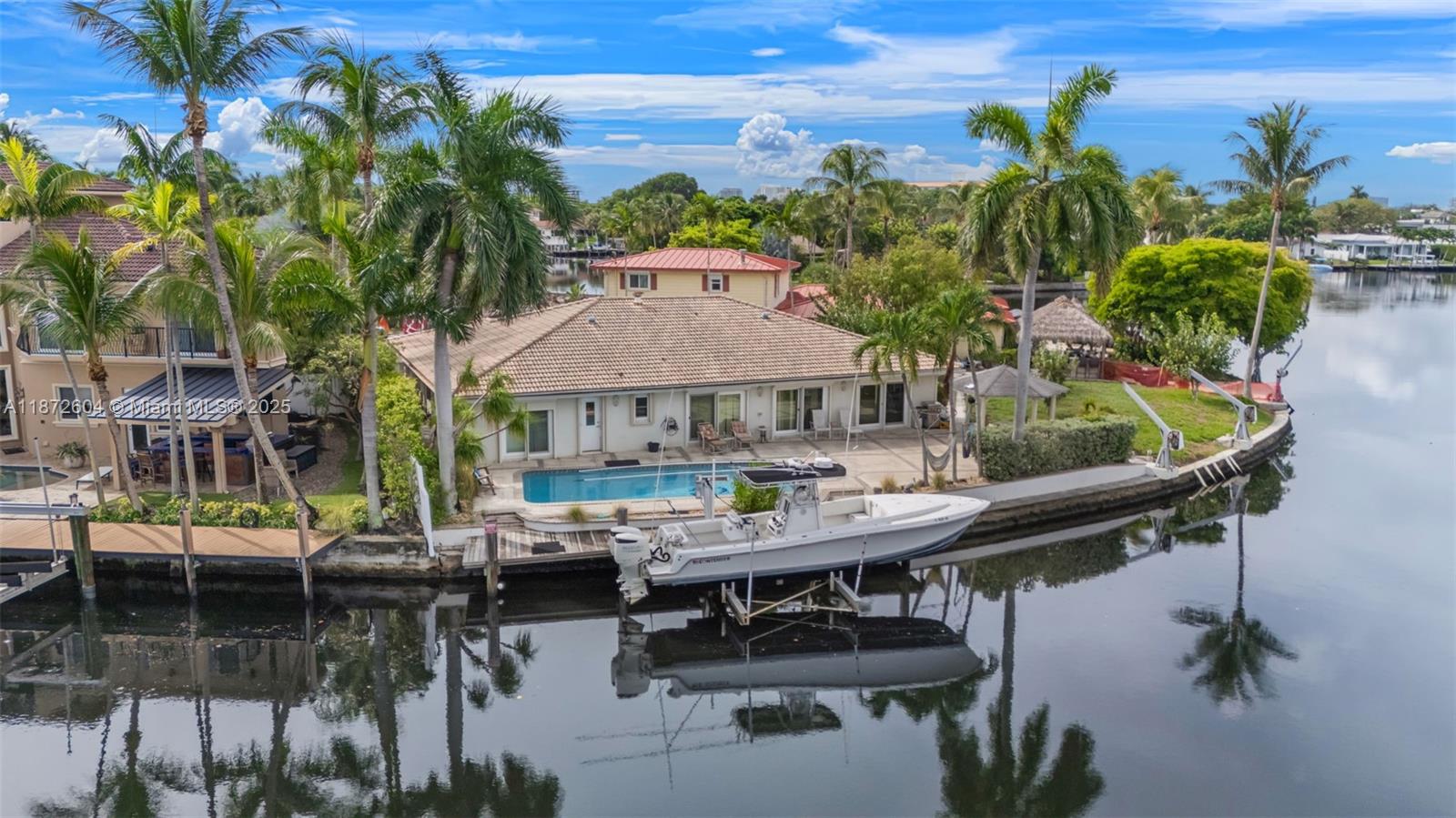 Welcome to 2401 Fryer Point, a rare point lot offering sweeping, panoramic views of the Middle River in Fort Lauderdale’s prestigious Coral Ridge neighborhood. With its enviable location and expansive waterfront exposure, this property is an exceptional canvas for a visionary buyer.
The residence features impact windows and doors, a boat lift, open design, and one of the best locations in the city. Whether you choose to renovate and elevate the existing home or design a brand-new luxury estate, this address delivers unmatched potential.
Located in the coveted Bayview Elementary school district, the property combines lifestyle and long-term value. From your private dock, enjoy ocean access and take in the breathtaking wide-water views that only a true point property can provide.