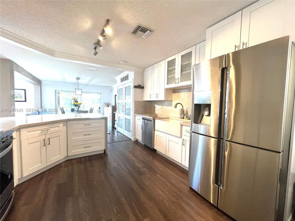 Photo of 9875 Fairway Cove Ln, Plantation, FL 33324 (MLS # A11943345)