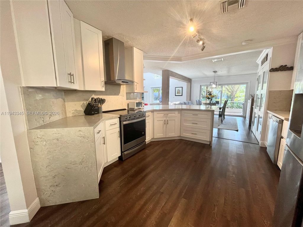 Photo of 9875 Fairway Cove Ln, Plantation, FL 33324 (MLS # A11943345)