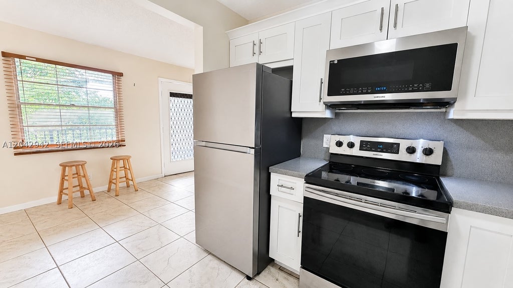 Photo of 301 SW 135th Ave #317C, Pembroke Pines, FL 33027 (MLS # A12042942)