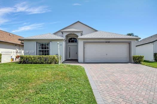 Just Reduced! If you're Downsizing or Need a Seasonal Getaway! Perfect Single Family 2/2 w/2 car garage & stacked Bedrooms both have renovated showers. Volume ceilings throughout with tiled floors. Both bedrooms are carpeted. Den or office off of the Main Bedroom. Pull downstairs in Garage. Reroofed 2017, new HWH. Outside house freshly painted, Gated 55+ Resort style community with 18-hole Golf course, Clubhouse, Billiards, Pool/Jacuzzi, Card room, Library, His & Her gyms, Sauna, Bocce ball, Tennis, Shuffleboard & Mini golf. Golf carts & walking paths. Centrally located in WPB, close I-95 Turnpike, Shopping, Beaches, Baseball & airport.