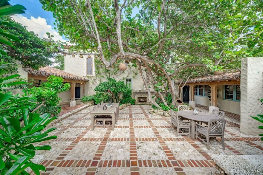 Designed with the laid-back luxury of California wine country in mind, this home is a study in a quiet elegance. Oversized lot is lusciously landscaped. Massive wood doors lead to a courtyard wonderland. Exquisite back patios, and terraced gardens extend the living area to the great outdoors. This is no ordinary setting! Inside you will find an extraordinary depth of detail. Gutted to the studs & restored to perfection. Italian wood plank & stone floors. The kitchen with 2 sinks & huge island/eat-in area opens to the courtyard & the formal dining rm. Master has His/Hers closets, sitting area and fireplace. 62 ft dock, newly capped seawall, 2-car garage & proper laundry room. Highest natural elevation on Miami Beach. Walk to the Ocean, restaurants, clubs, hotels, museums, the ballet etc.