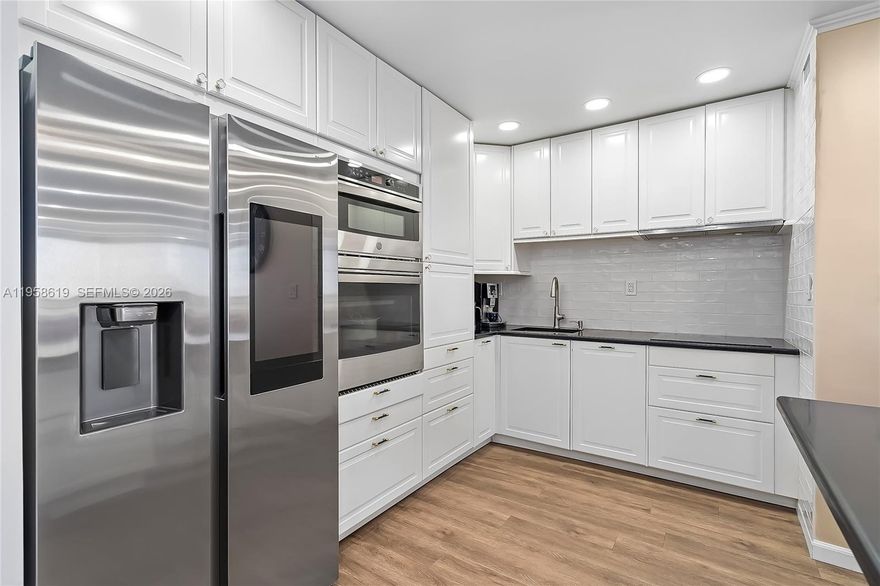 A fully reimagined 2-bedroom, 2-bath and a den residence with permitted work and an open-floor-plan kitchen, offering approximately 1,500 sq ft of beautifully designed living space. This home was renovated for personal enjoyment, not resale, and it shows in every thoughtful finish and upgrade. The open kitchen anchors the living space and was redesigned to maximize flow, light, and functionality. It features granite countertops, a Samsung smart refrigerator with integrated display, Samsung cooktop, Bosch dishwasher, GE oven/microwave combo, and a sleek Miele hood, all selected for performance, reliability, and modern aesthetics. The expanded living area, completed with fully permitted work, blends seamlessly into the open layout, creating a spacious, comfortable environment ideal for entertaining or everyday living. Built-in KEF speakers paired with a Sony receiver deliver rich, immersive sound throughout the main living space.
Bathrooms evoke a refined, spa-like atmosphere with automatic Woodbridge toilets and quality finishes that elevate daily living. Every improvement was thoughtfully executed, with attention to both form and function.
Located at 600 Three Islands Blvd, Unit 604, Hallandale Beach, this residence represents a rare combination of permitted upgrades, open design, premium materials, and genuine pride of ownership. An exceptional home to enjoy, where no detail was spared.