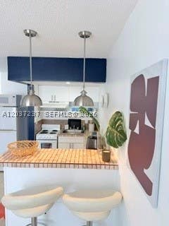 Photo of 13 NE 2nd Ave #203, Dania Beach, FL 33004 (MLS # A12037237)