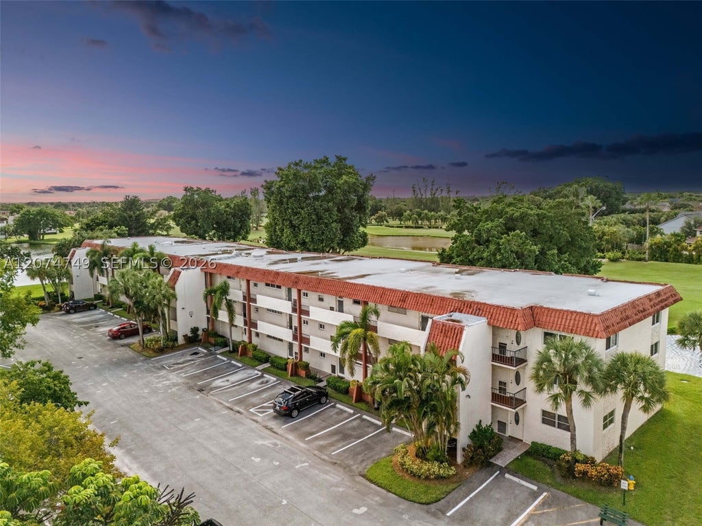 Photo of 9811 N Hollybrook Lake Dr #103, Pembroke Pines, FL 33025 (MLS # A12074749)