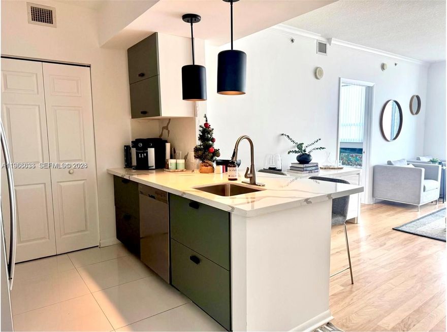 Beautifully updated 2 bedroom, 2 bath residence at Cité on the Bay, in the heart of walkable Edgewater. This unit offers a bright open layout with a split floorpan and views of Biscayne Bay and the Miami skyline from a private balcony. The remodeled kitchen features quartz countertops and stainless steel appliances. The updated unit is complemented by a brand-new AC and real hardwood floors throughout, plus in-unit washer/dryer. The spacious primary suite includes a walk-in closet and an ensuite bath with double vanity. Full-service luxury amenities include covered parking, a heated pool with sun deck and jacuzzi, fitness center, yoga studio, club room, workspaces, 24-hour concierge, valet, and security. Ideally located across from Margaret Pace Park and minutes to Wynwood, Midtown, and the Design District. The unit is currently rented through February 2027 at $3,800/month. This is an exceptional turnkey investment opportunity in an extremely well managed and maintained building.