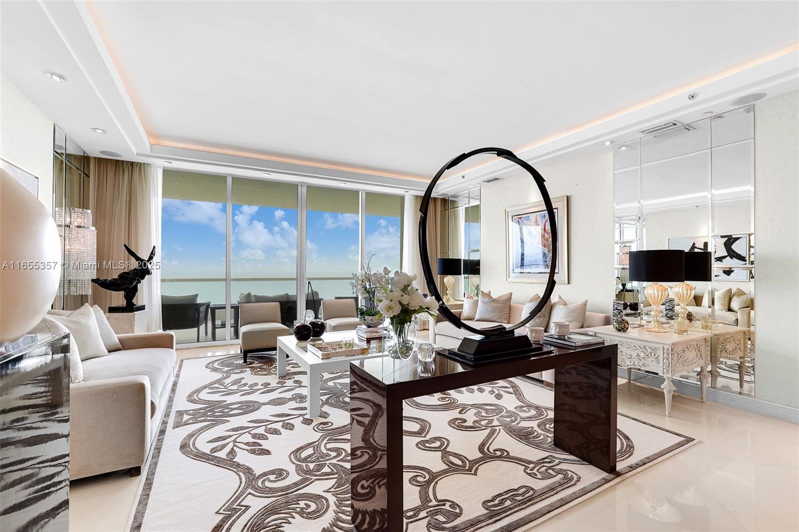 One of a kind beautiful flow through unit on 26th floor with direct ocean and intercoastal views - 3 bed + den + office , 4.5 bath and 3,500 SFT , 10 feet ceilings , fully furnished and finished with no expense spared . This professionally designed and decorated residence, private elevator foyer. 36x36 Italian marble floors throughout, complete closet systems, beautiful built-ins, snaidero kitchen, top-of-the-line appliances, sub-zero refrigerator, gas stove, cappuccino maker and more. Turnberry Ocean Colony is a gated community with prestigious service & resort style amenities that include valet parking, 2 heated pools, private spa, beach services, fitness center, club for the kids, hair salon, & 2 restaurants.