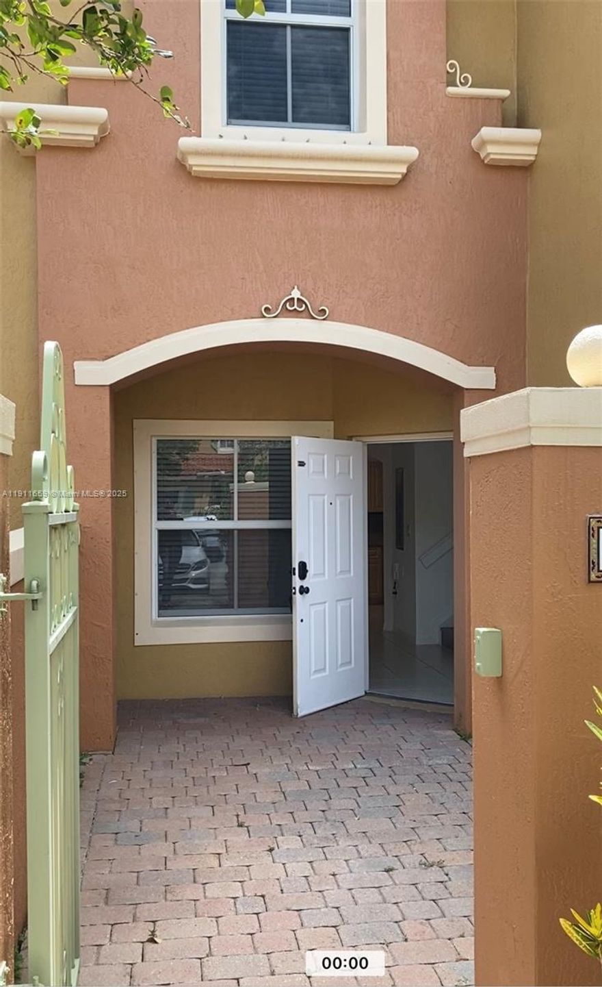 Beautiful 3-bedroom villa located just across from The Shops at Pembroke Gardens! This spacious home features vinyl flooring on the stairs and second floor, a modern kitchen with granite countertops, stainless steel appliances, a double door refrigerator, and a full-size washer and dryer. Enjoy a comfortable floor plan with a family room, two private paved courtyards perfect for BBQs, and a master bedroom with a private balcony. Nestled in a quiet gated community with immediate access to I-75 and top-rated schools. Experience the Pembroke Gardens lifestyle — steps away from premier shopping, dining, and entertainment. A must-see! Easy to show.