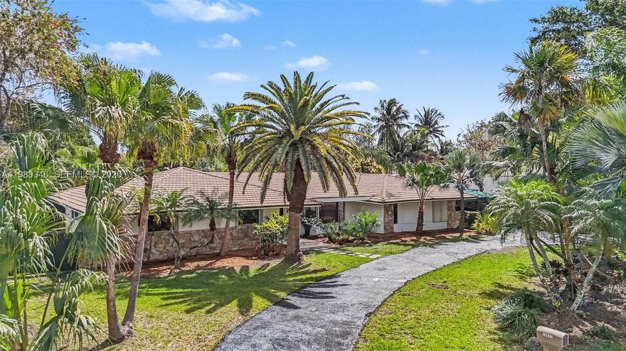 A remarkable property offering privacy, space, and comfort in a fabulous neighborhood. This beautiful estate home features 4 bedrooms and 3.5 bathrooms with a spacious and well-designed floor plan.The residence offers 2,730 sq ft of living space and 3,844 total sq ft, situated on an expansive 17,779 sq ft lot. The bright living room showcases elegant bay window with beautiful views of the pool and garden, creating a welcoming atmosphere filled with natural light.The open-concept kitchen flows seamlessly into the family room and connects to a separate glass-enclosed breakfast nook, both overlooking the pool area—perfect for everyday living and entertaining. The home also includes a formal dining room for special gatherings. Additional highlights include an air-conditioned 2-car garage, which can easily be used as a 5th bedroom, office, or flex space. The home has been freslhy painted inside and outside, upgraded bathrooms,and recent improvements include smart thermostats and smart light switches, a new sprinkler system, an electric vehicle charging plug, and hurricane accordion shutters. Ideally located just 5 minutes from The Falls Shopping Center, various Supermarkets, dining, and the YMCA, this home offers convenience while maintaining a peaceful residential setting.