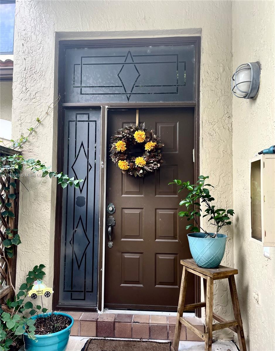 Welcome to this beautifully maintained 3-bedroom, 2-bathroom townhome condo located in the highly sought-after Bridgewater community in Plantation, Florida. Offering 1,760 square feet of living space, 2-Level Layout: Entry foyer on the first floor leads to the main living areas on the second floor. Enjoy a formal dining room, a spacious living room, and a cozy eat-in kitchen perfect for family gatherings and entertaining. Includes a remodeled master bathroom featuring a ceramic tile tub and separate shower. The second bathroom also offers a walk-in shower. Dedicated desk space with a mini bar—ideal for work or relaxation. One-car garage with additional driveway parking. Don’t miss out on this opportunity to own a spacious and updated townhome in the heart of Plantation!
