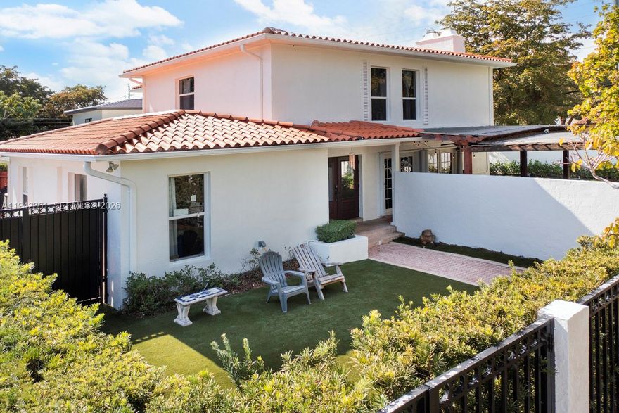 Located in The Roads, one of Miami’s most desirable & centrally located neighborhoods, this 5-bedroom, 4-bath Spanish-style corner-lot residence offers rare scale, character,& timeless charm. Unlike much of today’s newer construction, the home features warm, inviting spaces & architectural details that are increasingly hard to find. A true rarity in The Roads, the residence offers generous interior volumes—larger than many older homes in the area—without the sterile feel or premium pricing of newer construction. The family room showcases vaulted ceilings with beautiful exposed wood paneling, creating a welcoming focal point for everyday living & entertaining. The home features formal living & formal dining areas, two staircases, two fireplaces, & a spacious kitchen equipped with two dishwashers, ideal for hosting & multi-generational living. Impact windows & doors are installed throughout, with accordion shutters protecting the French doors for added peace of mind.
Outdoor living features a fully walled property for added privacy, multiple patios, lush turf landscaping, & a pool, creating a private, easily maintained, & inviting setting for year-round enjoyment.
Perfectly positioned within walking distance to the Underline, Vizcaya, Brickell, & just minutes from Coconut Grove, Coral Gables, & Miami’s premier dining, shopping, & lifestyle destinations. Immediate access to I-95 provides convenient connectivity throughout South Florida.