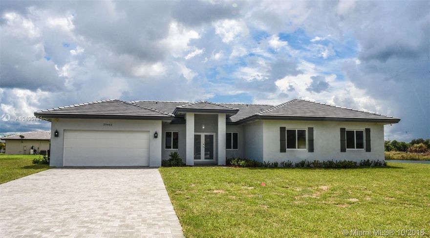 New Construction Estate Home around a half-acre lot. Ready in NOVEMBER 2018. 5 bedroom 3 full baths. Home includes 10,000 DOLLARS IN UPGRADES INCLUDED- WOOD TILE, UPGRADED TILE IN BATHROOM WALLS, PANTRY, DOUBLE FRONT FROSTED IMPACT DOOR AND TANK LESS WATER HEATER. Stainless Steel Appliances, Vaulted Ceiling, Porcelain Tile Throughout, Granite Counter Tops and a selection of finishes your clients can choose from to make their home unique. The community is on a 40 acre parcel with a pristine lake in the center. No HOA. Plenty of room to store all your recreational toys.