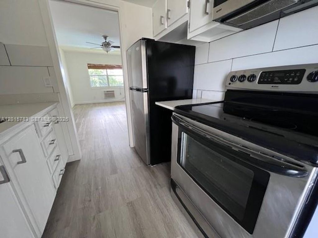 Photo of 1350 E Sample Rd #306, Pompano Beach, FL 33064 (MLS # A12015783)