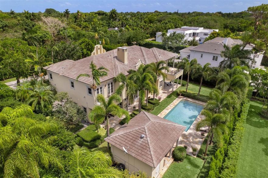 This chateau-inspired 9,289 SF, 7-BD, 8-BA gated residence boasts a meticulously designed layout on an expansive 29,292 SF lot. Upon entry, the stunning grand foyer offers voluminous ceilings, complemented by an exquisite marble staircase. A true chef’s kitchen features an expansive island, marble countertops, custom cabinetry, premium appliances and a gas range, built-in coffee-espresso machine, and water filtration system. Outdoor spaces include covered terraces, a fully equipped summer kitchen, heated pool with jacuzzi, and lush landscaping and hedges that offer complete privacy. Additional features include impact windows and doors, wine cellar, media room, whole-house generator, smart home with integrated lighting, audio, and security systems, a 3-car garage and a brand new roof.