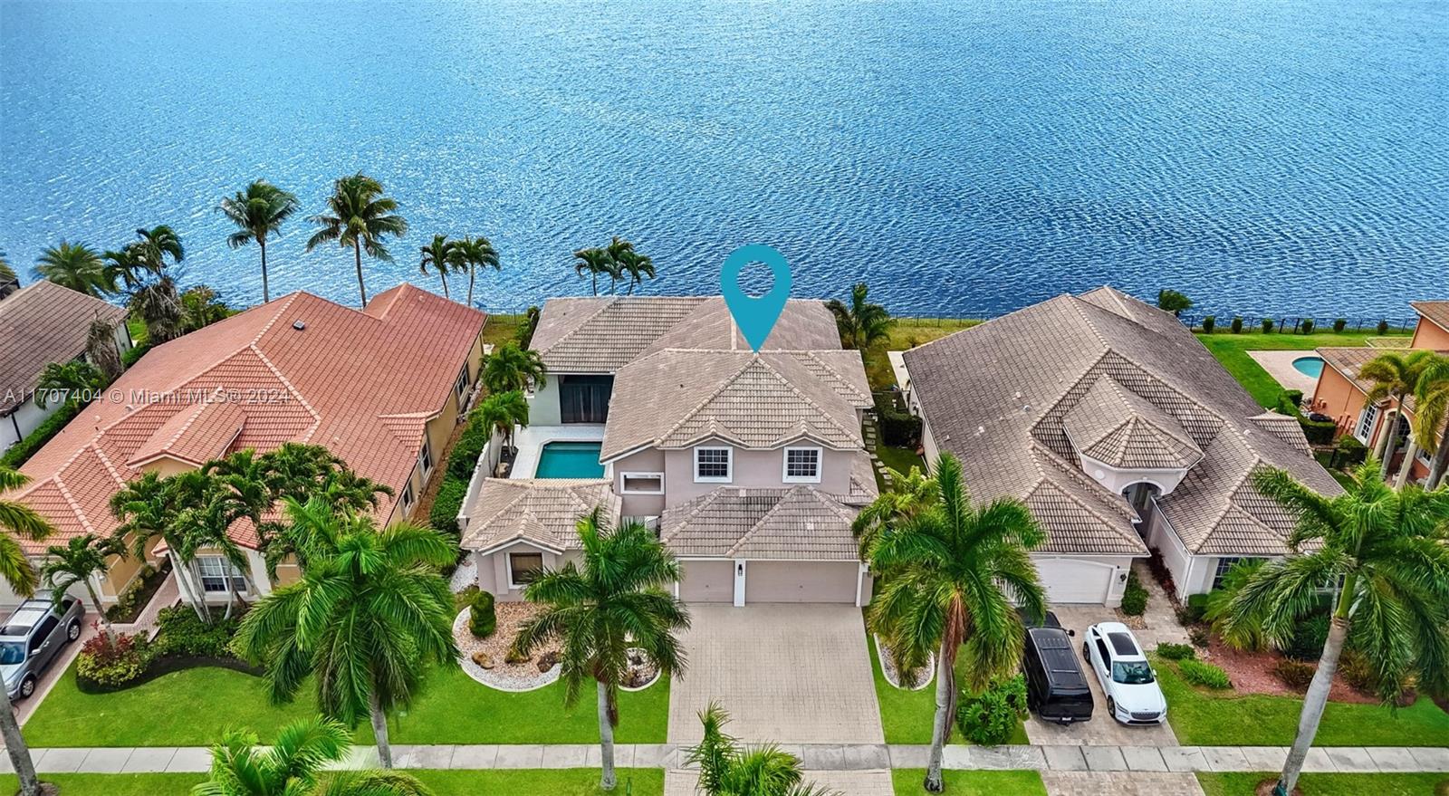 Welcome to this modern two-story courtyard home W/pool on one of Miramar's largest lakes in the prestigious Sunset Lakes. This lakefront estate features 6beds, 5baths, including in-law quarters with independent access. The home boasts modern finishes, a split floor plan, vaulted ceilings, and abundant natural light. The spacious primary suite on the 1st floor offers stunning lake and pool views. The upgraded gourmet kitchen includes SS appliances and granite countertops. Additional features include Nest/ADT security cameras, A/C(2023/2014), all baths(2022), marble tile flooring on the 1st level, and laminated wood on the 2nd. Enjoy resort-style amenities, including a clubhouse, pool, tennis courts, volleyball, & more. Schedule your private tour today!