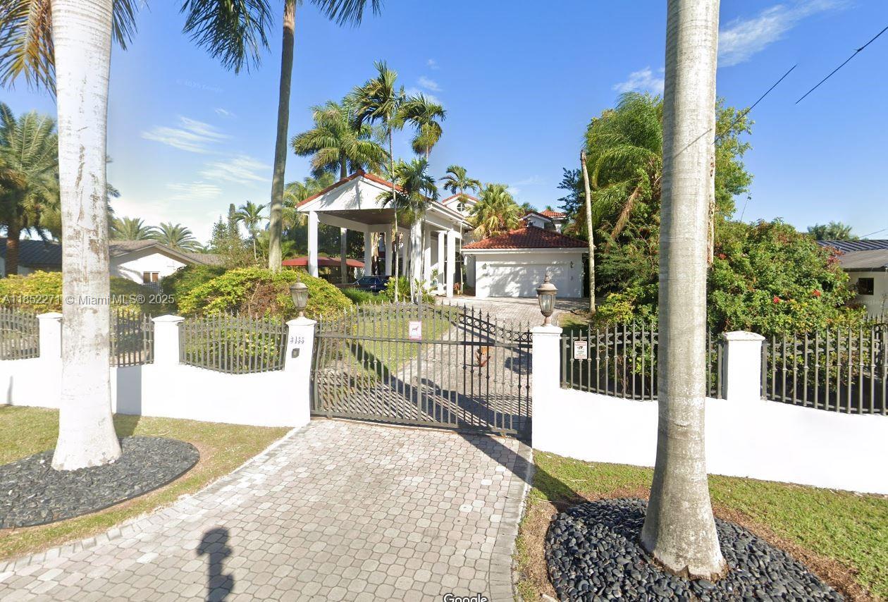 This unique residence is set behind private gates on a spacious 30,492 s/f lot, featuring a stunning circular driveway that leads to a porte-cochere entrance and a 2-car garage. Built on an elevated site, the home offers 6,723 total s/f with 5 bedrooms, 3 bathrooms, and a separate office. Upstairs, you’ll find a Jack & Jill layout and two master bedrooms—both with access to a large shared balcony, perfect for enjoying morning coffee or evening sunsets. Recent updates include a renovated kitchen, new fencing, sprinkler system, and recent tenting. The pool has been newly resurfaced with fresh plaster and includes a jacuzzi for added relaxation. Interior features include elegant Carrera marble floors, grand entrance columns, and a electric generator. Located near top-rated A+ schools.