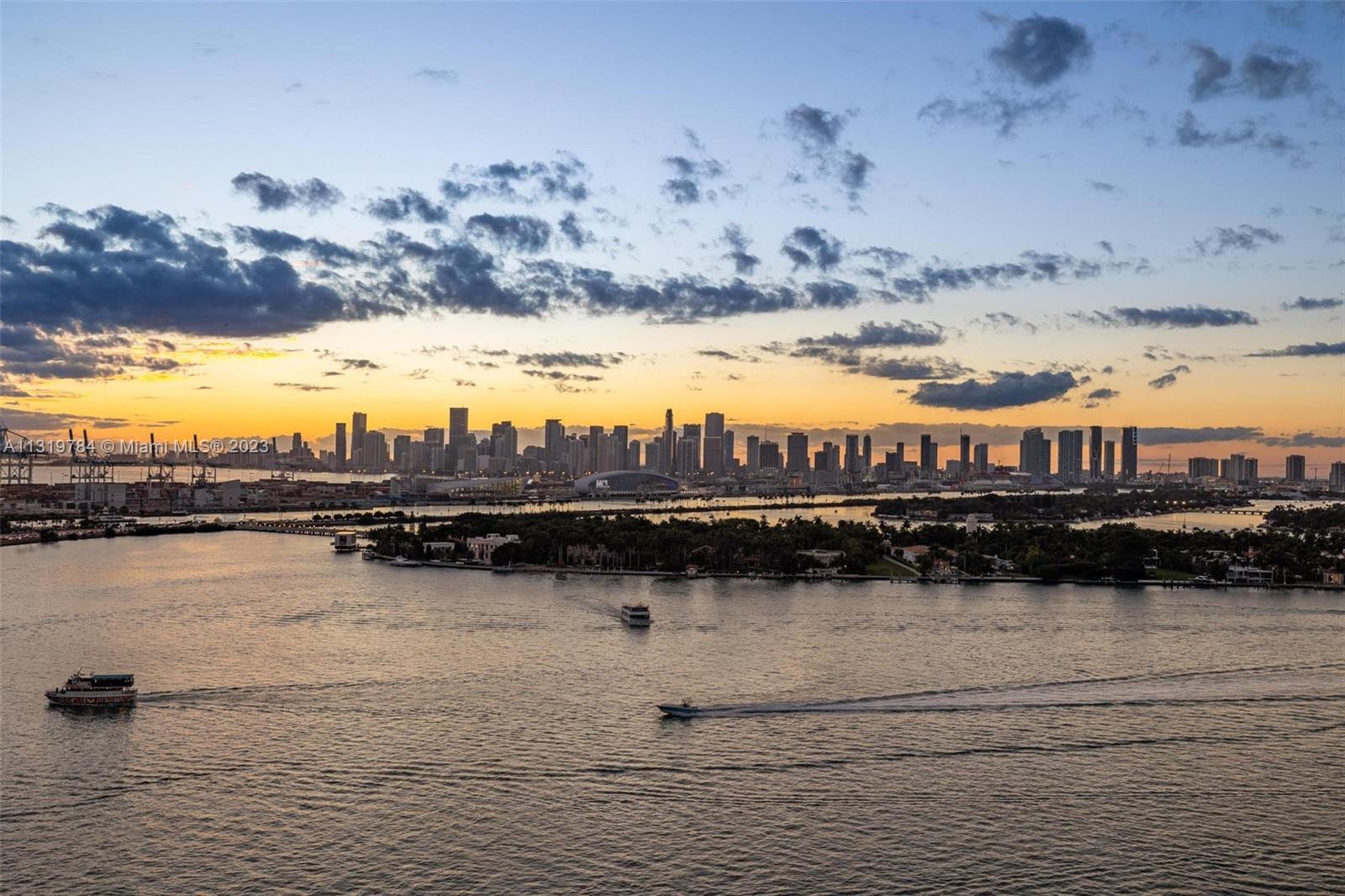 Magnificent sunsets over the Miami skyline from the balcony of this gorgeous 2 bed, 2 bath condo at the Floridian. Spectacular views of Star Island, downtown and the Bay. Wood flooring throughout main rooms with built-ins. Upgraded bathrooms and kitchen. Full service building offers 2 pools, jacuzzi, 24hr security, restaurant, convenience store, gym, spa, parking +valet and tennis court. Easy to show.
