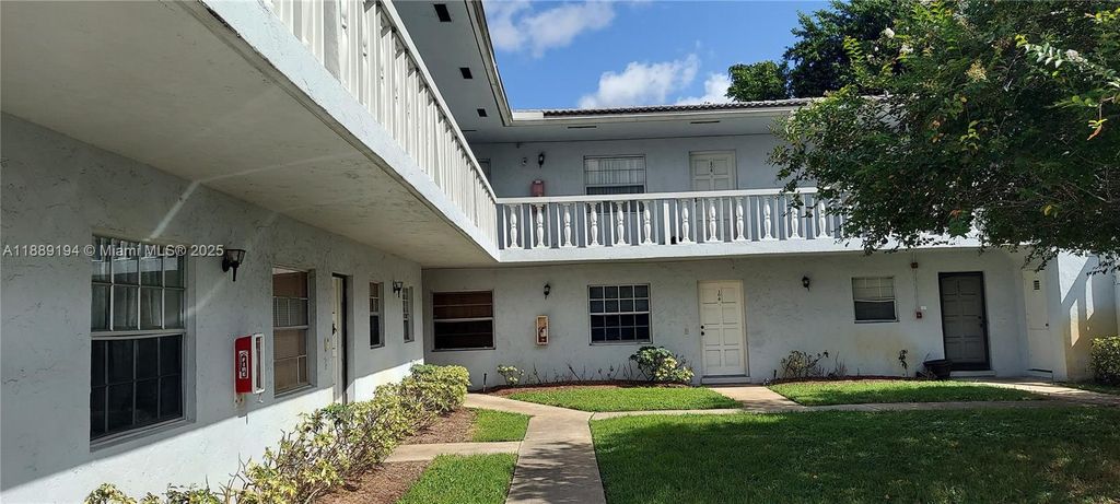 Photo of 4140 Woodside Dr #202, Coral Springs, FL 33065 (MLS # A11889194)