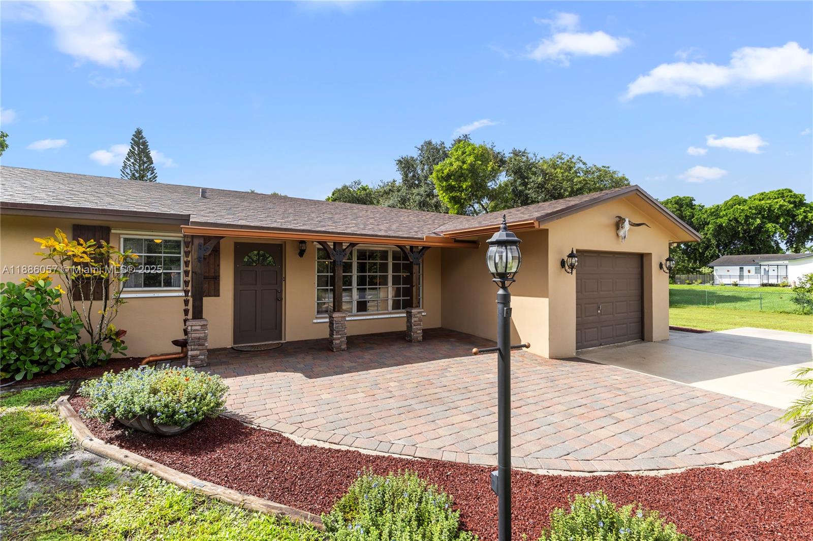 Rustic charm meets modern comfort in this well maintained Davie gem on a full acre with NO HOA. Room for horses, boats, or RVs! Inside features an original stone wall, wood floors, and new laminate in 2 bedrooms. The kitchen offers classic wooden cabinets, new flooring, and space for dining, plus a cabana bath with backyard access. Major updates: new roof (2023), A/C (2016), hurricane protection, well pump (2020), pool pump (2020), and full-house generator hook-up. Outdoors enjoy a sparkling pool, spacious yard, and large shed with electricity. 1-car garage + driveway for 8 vehicles. Much Much More. Priced to sell—A MUST SEE!