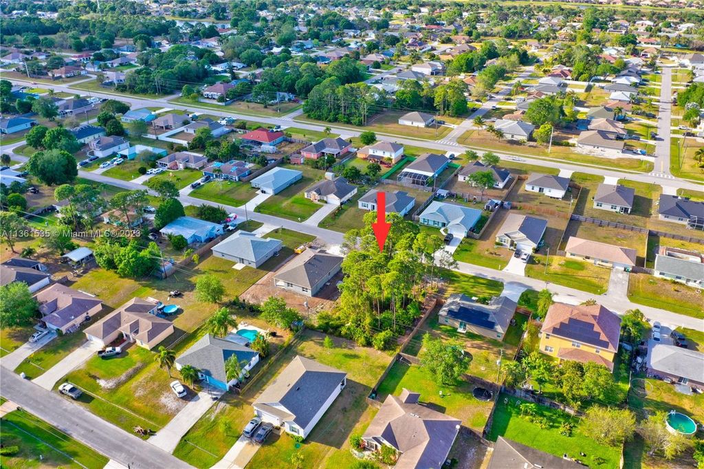 Photo of 1302 Goodman Ave, Port Saint Lucie, FL 34953 (MLS # A11361535)