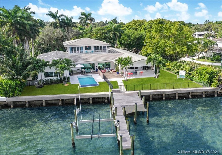 Live in a Spectacular Home right on Biscayne Bay. With more than 100ft of water frontage, this 6000 SqFt home has plenty of space and breathtaking views. Custom built on a 17,500 SqFt lot the property offers 6 bedrooms, 8 bathrooms, large indoors and outdoor entertaining areas, infinity salt water pool, sauna, bocce court, top of the line appliances, state of the art security system, touch-less home delivery set up, play room and a brand new dock/lift with 30,000 lbs capacity.