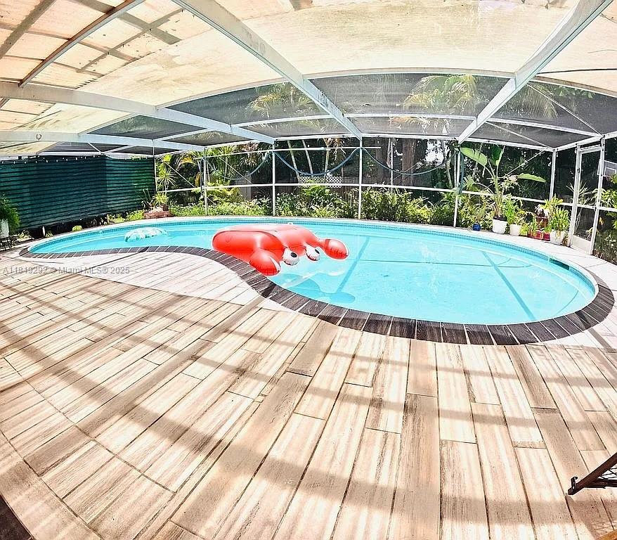 Tropical oasis in Tamarac! This home features bananas, star fruit, coconuts, pineapple, pomegranate, sapodilla, sherbet berry, and a rare Pakistani mango tree. Enjoy a heated pool, new appliances under warranty, and an electric vehicle charging station. Located near A-rated schools, a top hospital, and just 15 minutes from Sawgrass Mall. Your exotic, upgraded paradise awaits!