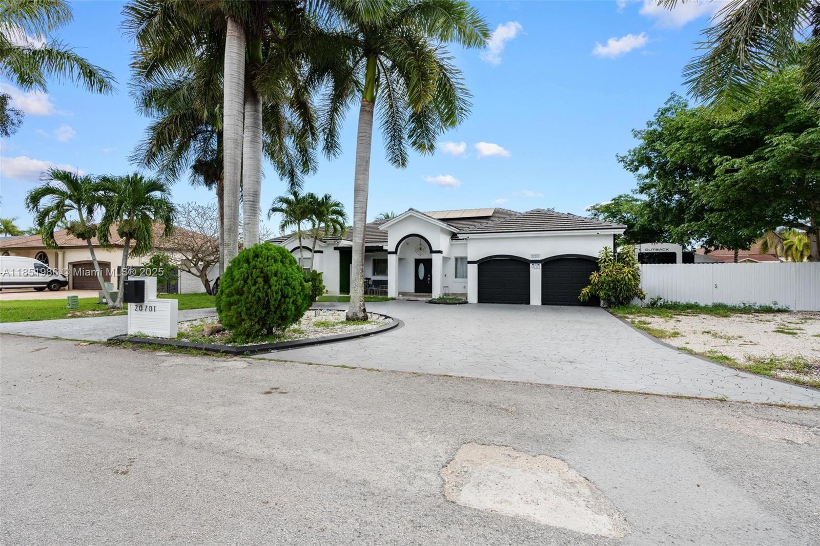 5/4 home on a spacious 14,000+ sqft lot. Featuring vaulted ceilings, open-concept layout filled with natural light.The sleek kitchen offers quartz countertops, a large island, and custom cabinetry. The primary suite includes a spa-style bath with soaking tub. Enjoy a dedicated laundry area and an additional office space. Fully remodeled, full roof replacement, newer A/C, with enough solar panels to cover the majority of your FPL bill. Enjoy NO HOA - large lot that is fully fenced with a covered terrace and plenty for RV, or boat or future builds. Above ground pool is included in the sale. RV can be negotiated with the sale. Home is perfect for income producing split plans. Convenient location near the Turnpike, US-1, Publix, and A Rated Schools. Move in ready!