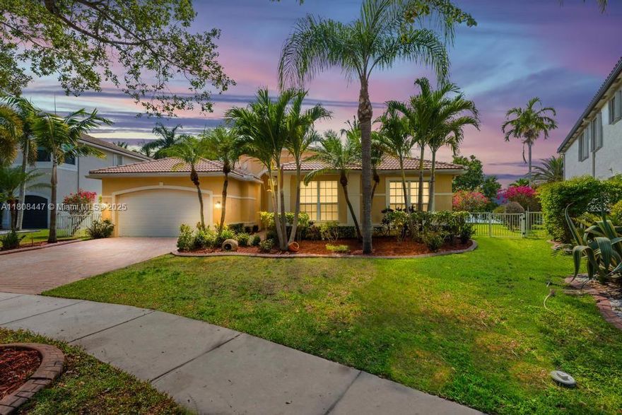 Nestled on a spacious lot along the largest lake in Sunset Lakes, this stunning one-story home offers breathtaking panoramic water views. Enjoy spectacular sunsets each evening from the comfort of your private retreat. This beautifully designed home features 5 bedrooms, 3 full bathrooms, a formal living room, a formal dining room, and an open-concept kitchen with a cozy eat-in area that flows seamlessly into the family room—perfect for both everyday living and entertaining. sunset Lakes offers resort style amenities and is a guard gated community centrally located to shopping, restaurants, schools, and all major highways.