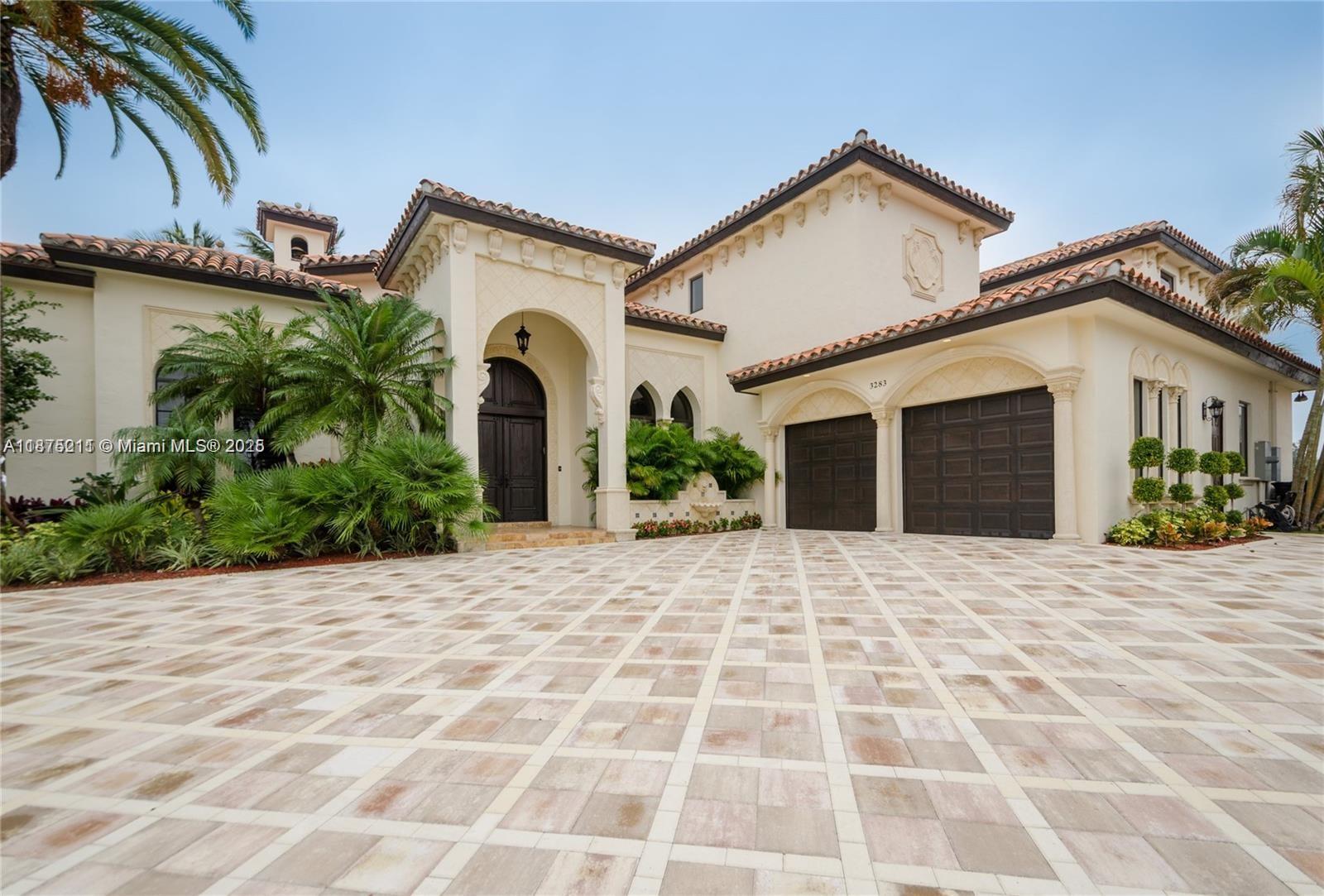Welcome to your dream waterfront retreat! This Mediterranean masterpiece sits on a rare point lot with 220 ft of sparkling waterfront and a private 80-ft dock offering direct ocean access! Perfect for yacht owners and water enthusiasts, you’ll be just minutes from Haulover Inlet. Inside, over 6,300 sq ft of luxury living awaits, featuring 5 spacious bedrooms, 5.5 baths, marble and hardwood floors, soaring ceilings, and endless natural light. The chef’s kitchen, grand living areas, and maid’s suite make it ideal for entertaining and everyday comfort. Features a heated pool & spa, expansive terraces, and breathtaking views that capture Miami living at its finest. Tucked inside the guard-gated Eastern Shores community, this estate offers the perfect blend of privacy & prestige.