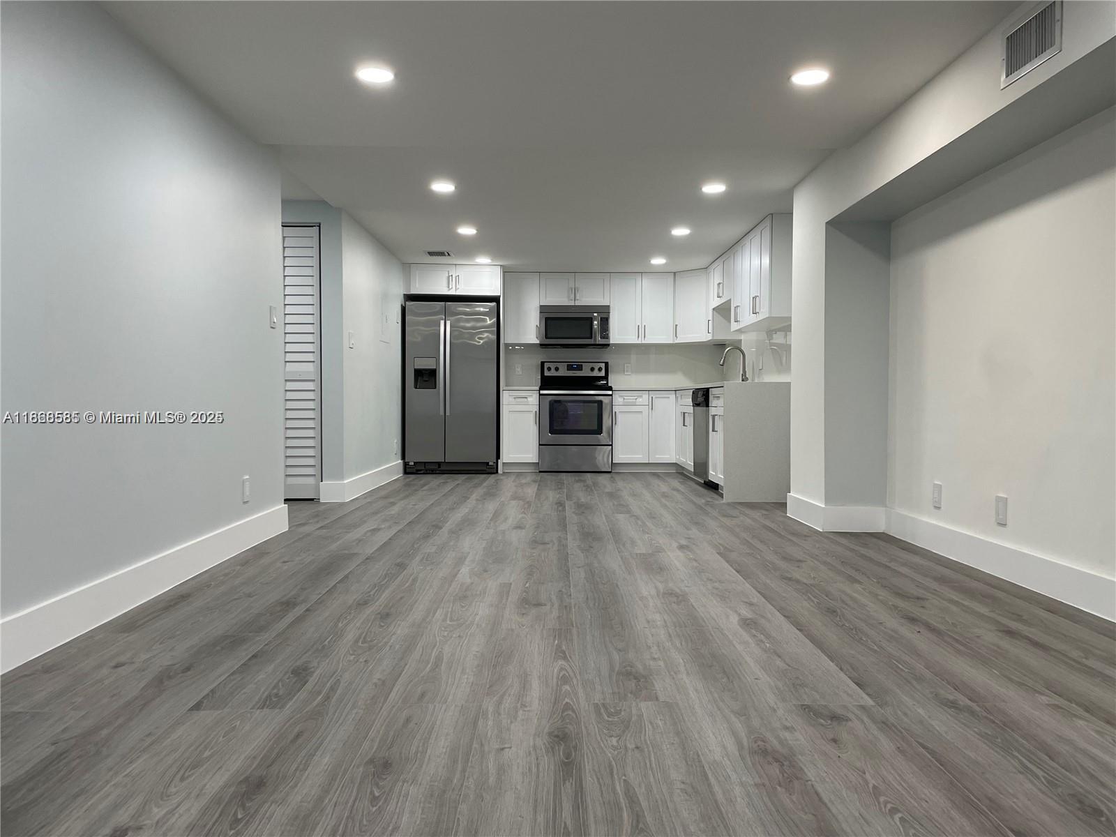 Seller motivated! Just leased for $2,350/month for 12 months, this 1st-floor corner 2-bed/2-bath condo offers 1,200 SF of fully renovated living space with modern interiors, wood laminate floors, abundant natural light, and a spacious primary suite with walk-in and additional closet. Features include stainless steel appliances, in-unit washer/dryer, and 2 assigned parking spaces directly in front plus ample guest parking. Pet friendly (max 15 lbs). Association requires 650+ credit score per occupant 18+. Community amenities include pool, gym, and tennis courts. Centrally located near Turnpike, schools, shopping, dining, and entertainment.