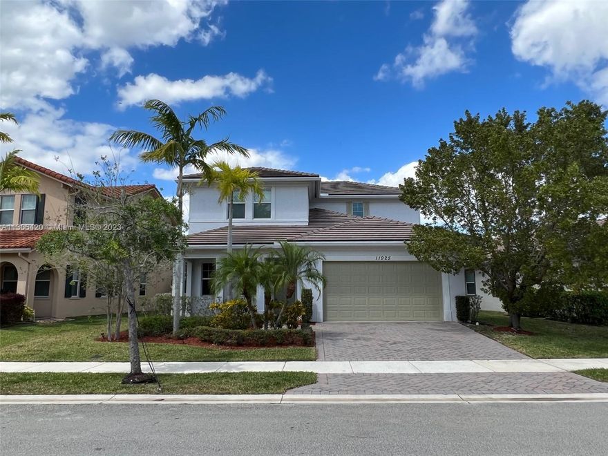 Beautiful lake-front single family home in prestigious Heron Bay.