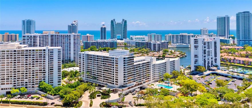 Experience luxury living in this beautifully renovated 3BR/3BA oversized corner condo in the prestigious Olympus on exclusive Three Islands. This rare residence features sweeping water and city views, rich dark wood floors, and fully built-out closets—including a spacious walk-in in the primary suite. Enjoy a sleek open layout, updated kitchen & bathrooms with elegant designer finishes, newer A/C for year-round comfort, plus 3 storage areas. Olympus spans 18+ acres of resort-style grounds with 2 pools (one on the Intercoastal), tennis courts, BBQ/picnic areas, a newly renovated state-of-the-art fitness center, and 24hr security. Just minutes to beaches, Aventura Mall, dining, and world-class shopping. Easy to show.