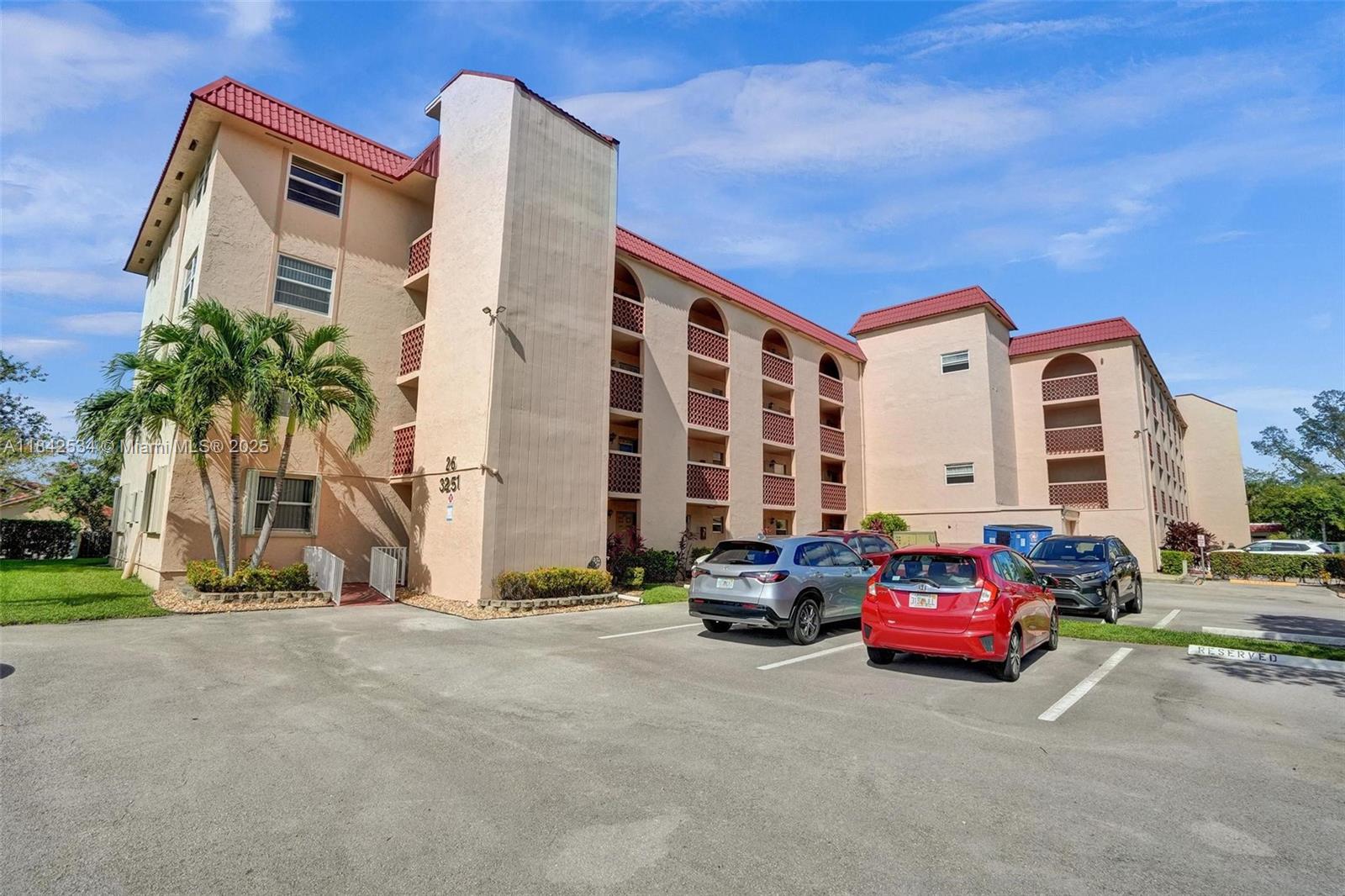 Last 2 sales $135K & $100K in this rarely available, amenity-rich Holiday Springs!. Larger than most, this corner penthouse offers canal & garden views from the screened patio! Features:16x16 tile throughout, updated bath, neutral kitchen with stainless & black appliances, plus same-floor laundry, trash & elevator. Enjoy resort-style amenities: heated pool, gym, tennis, pickleball, sauna, fitness classes, social events & more! Quiet, 55+ community with walking paths. Excellent location near Turnpike, Sawgrass, hospitals & more. HOA ($905/mo) incls water, cable, roof repair & reserves. No rentals or pets (except service animals). Min. 650 credit, 20% down, 6 mo of maintenance held in escrow for 18 months. Easy to show & close!