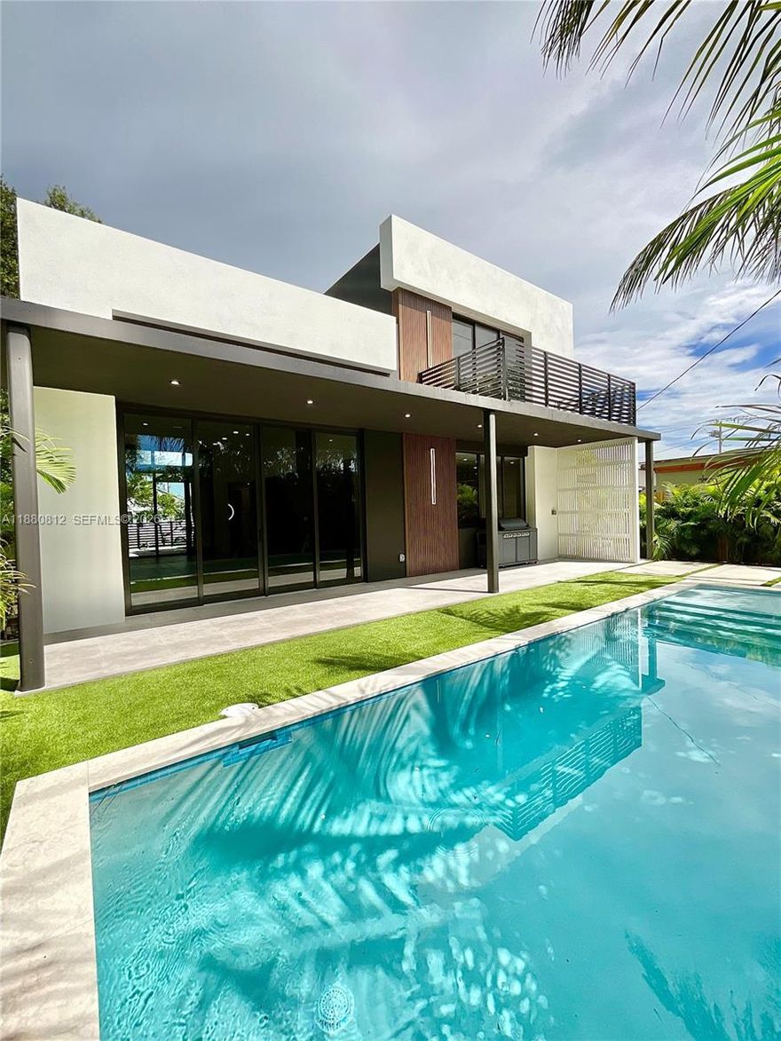 Best value in the trendy Buena Vista neighborhood. This stunning 2-story, residence completed in 2025 is a modern masterpiece that seamlessly blends bold design with refined elegance. Soaring vaulted ceilings and sleek architectural lines create an open, airy atmosphere, while designer finishes are thoughtfully curated throughout. At the heart of the home lies a show-stopping chef’s kitchen, complete with custom cabinetry, a striking oversized island, and seamless flow for effortless entertaining. The residence offers a well-balanced floor plan with spacious bedrooms and bathrooms on both levels, designed to provide privacy, comfort and flexibility. Customized eight-foot, solid wood interior doors offer an elegant touch with additional privacy through significant internal noise reduction. Indoor-outdoor living is redefined with a covered lanai perfect for year-round entertaining, complemented by a sleek pool design that sets the stage for lively gatherings. This spacious home was designed for comfort and convenience in Miami's fastest growing neighborhood. Closed comparable sales in the neighborhood exceed $890 PSF. Seller to contribute to buyer closing costs. 
INVESTORS: Short-term rental license available with NO HOA.