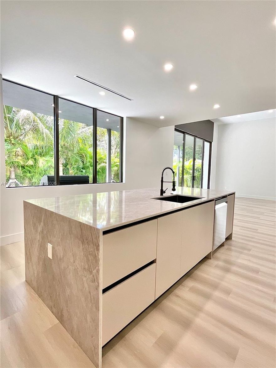 Take advantage of new, lower interest rates. This stunning 2-story, residence completed in 2025 is a modern masterpiece that seamlessly blends bold design with refined elegance. Soaring vaulted ceilings and sleek architectural lines create an open, airy atmosphere, while designer finishes are thoughtfully curated throughout. At the heart of the home lies a show-stopping chef’s kitchen, complete with custom cabinetry, a striking oversized island, and seamless flow for effortless entertaining. The residence offers a well-balanced floor plan with spacious bedrooms and bathrooms on both levels, designed to provide privacy, comfort and flexibility. Customized eight-foot, solid wood interior doors offer an elegant touch with additional privacy through significant internal noise reduction. Indoor-outdoor living is redefined with a covered lanai perfect for year-round entertaining, complemented by a sleek pool design that sets the stage for lively gatherings. This spacious home was designed for comfort and convenience in Miami's fastest growing neighborhood. Closed comparable sales in the neighborhood exceed $890 PSF. Seller to contribute to buyer closing costs. 
INVESTORS: Short-term rental license available with NO HOA.