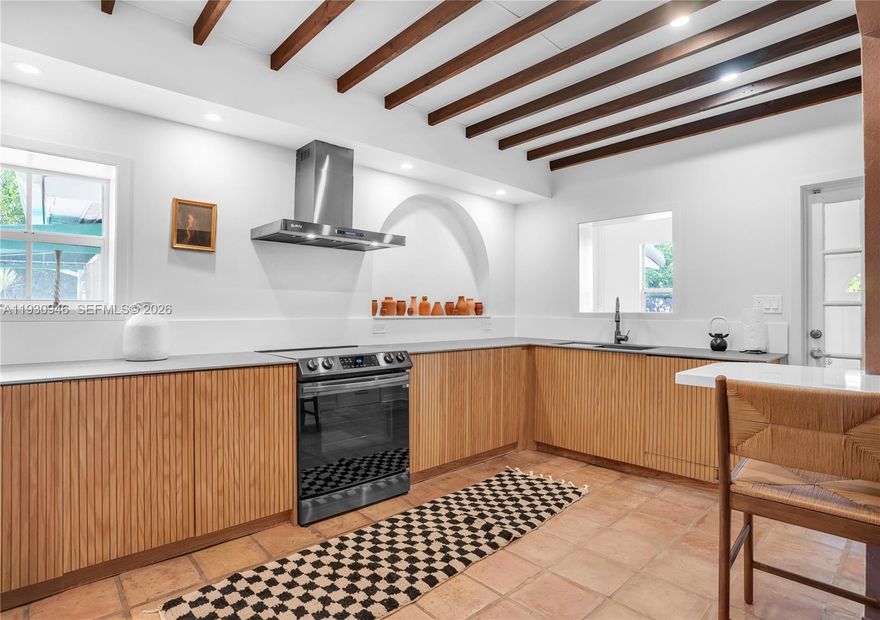 Just a 7-minute walk to the beach, this Mediterranean-style 4-bedroom, 4-bath home is fully furnished, move-in ready, and blends timeless character with modern upgrades—including a new metal roof for peace of mind.

Set on an oversized 12,815 sq. ft. lot, the private backyard is built for both relaxation and recreation: fire up the grill on the built-in BBQ island, unwind in the hot tub, cool off in the in-ground pool, or work out in the dedicated calisthenics area under swaying palms. It’s a versatile space ideal for entertaining and active living.