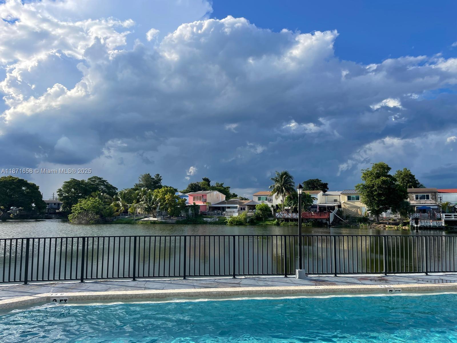 First-floor apartment. 2-bedroom, 1.5 Bathroom home in the heart of Hialeah! This spacious unit features an inviting living room filled with natural light and two generously sized bedrooms with serene lake views. Enjoy the convenience of on-site laundry facilities, a sparkling community pool, one assigned parking space plus guest parking. Ideally located just minutes from Miami International Airport, Downtown Miami, Doral, and Brickell. The building has already completed its 40-year recertification, offering peace of mind to buyers. Low association fee and no rental restrictions make this property a perfect choice for both end-users and investors.
