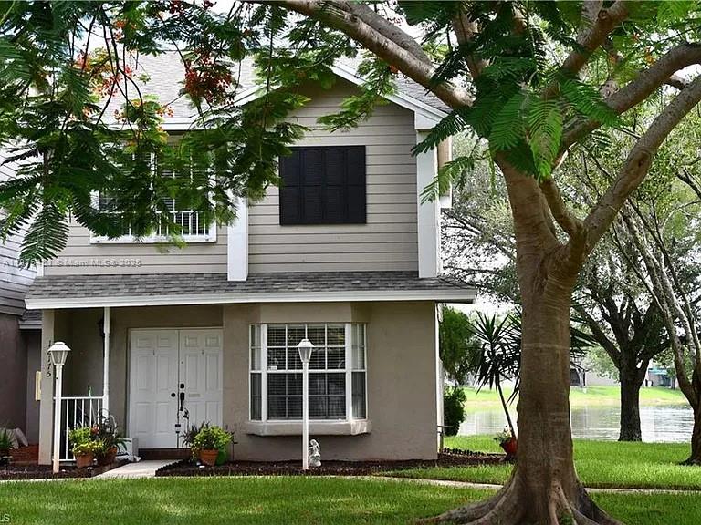 Experience tranquil lakefront living in this two-story villa at Colony Courts. Featuring two spacious primary suites with vaulted ceilings and 2.5 baths, this home offers a bright and functional layout. The main level includes a first-floor entry, open living and dining areas, eat-in kitchen, and built-ins for added storage. Step onto your private patio with wide water views, or enjoy the community pool just steps away. Low HOA covers building exterior, insurance, landscaping, and parking. Pet-friendly with leasing allowed, making it ideal as a primary residence or an income-producing investment. Just minutes to Sawgrass Mall, dining, and the expressway, this home blends comfort, convenience, and resort-style living. Take in views of the lake and landscape during your leisure time weekly.