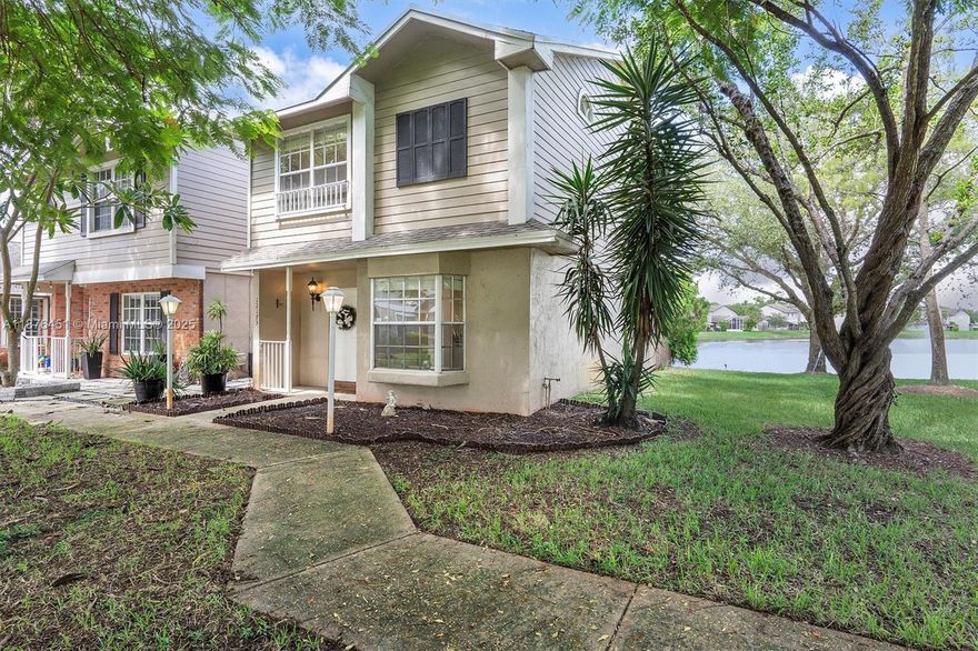 Experience tranquil lakefront living in this two-story villa at Colony Courts. Featuring two spacious primary suites with vaulted ceilings and 2.5 baths, this home offers a bright and functional layout. The main level includes a first-floor entry, open living and dining areas, eat-in kitchen, and built-ins for added storage. Step onto your private patio with wide water views, or enjoy the community pool just steps away. Low HOA covers building exterior, insurance, landscaping, and parking. Pet-friendly with leasing allowed, making it ideal as a primary residence or an income-producing investment. Just minutes to Sawgrass Mall, dining, and the expressway, this home blends comfort, convenience, and resort-style living. Take in views of the lake and landscape during your leisure time weekly.