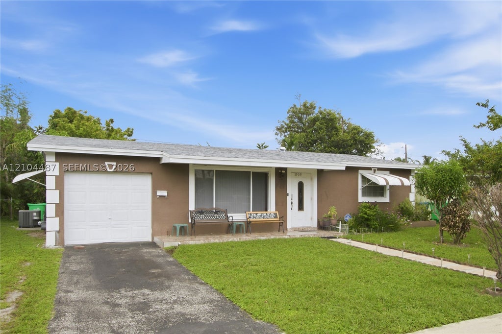 Photo of 5909 NW 16th Ct, Sunrise, FL 33313 (MLS # A12104487)